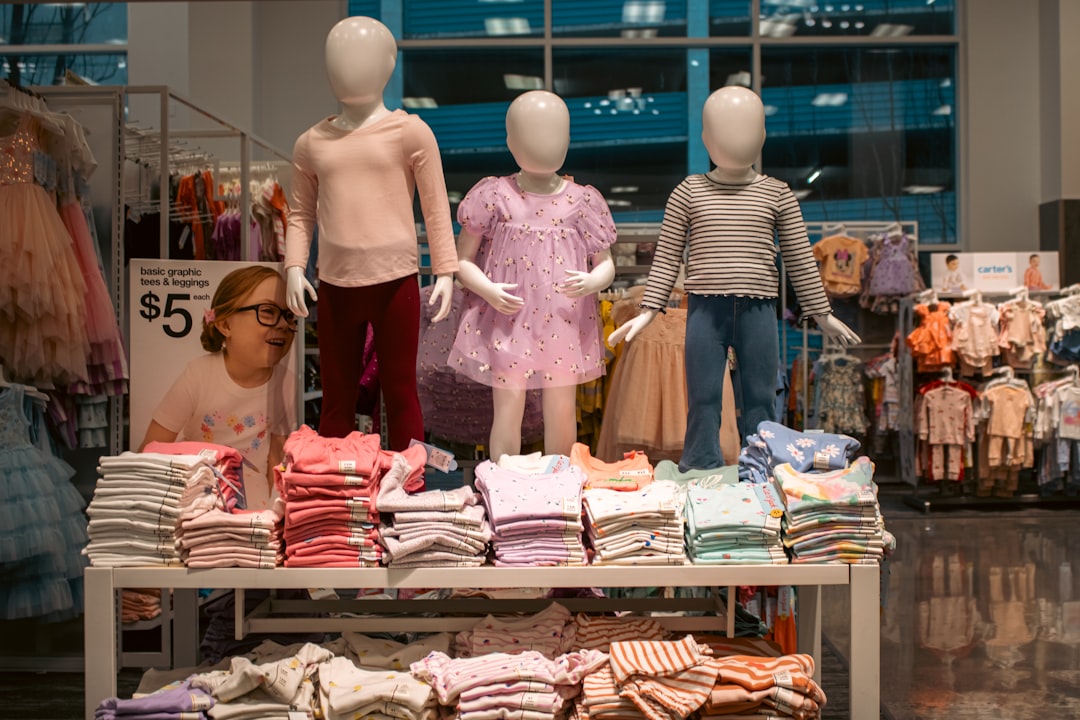 Home Three child-sized mannequins are prominently displayed, showcasing various outfits at Target Downtown Seattle.